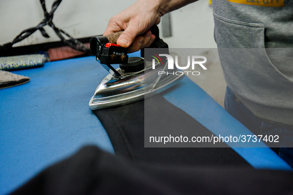 A person works inside a Neapolitan tailoring factory in Naples, Italy, on January 30, 2019 