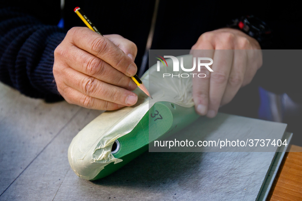 A person works inside a Neapolitan tailoring factory in Naples, Italy, on January 30, 2019 