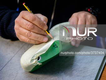 A person works inside a Neapolitan tailoring factory in Naples, Italy, on January 30, 2019 (