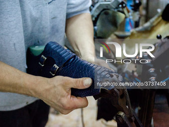 A person works inside a Neapolitan tailoring factory in Naples, Italy, on January 30, 2019 (