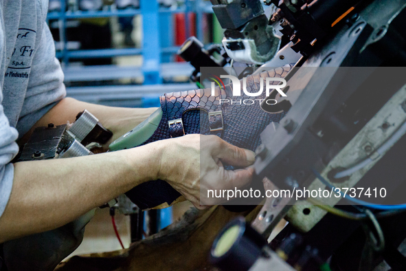 A person works inside a Neapolitan tailoring factory in Naples, Italy, on January 30, 2019 