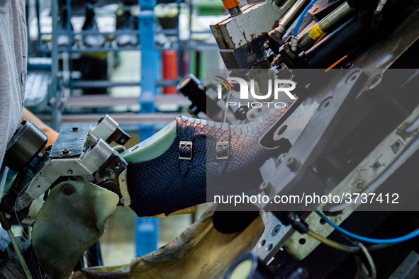 A person works inside a Neapolitan tailoring factory in Naples, Italy, on January 30, 2019 