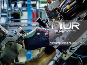 A person works inside a Neapolitan tailoring factory in Naples, Italy, on January 30, 2019 (