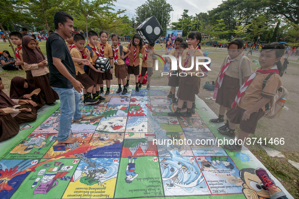 Students play in the Back to School Campaign held by the Sayangi Tunas Cilik Foundation (STC) at Vatulemo Field, Palu, Central Sulawesi, Ind...