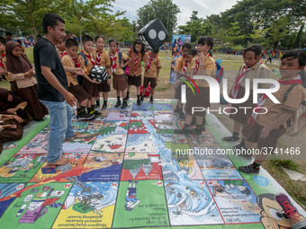 Students play in the Back to School Campaign held by the Sayangi Tunas Cilik Foundation (STC) at Vatulemo Field, Palu, Central Sulawesi, Ind...