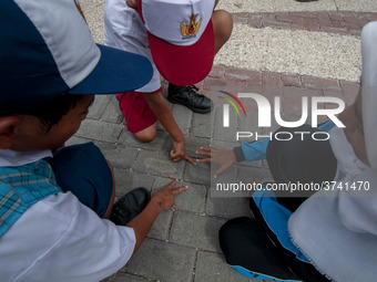 Students play in the Back to School Campaign held by the Sayangi Tunas Cilik Foundation (STC) at Vatulemo Field, Palu, Central Sulawesi, Ind...