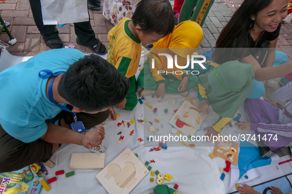 Students play in the Back to School Campaign held by the Sayangi Tunas Cilik Foundation (STC) at Vatulemo Field, Palu, Central Sulawesi, Ind...