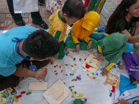 Students play in the Back to School Campaign held by the Sayangi Tunas Cilik Foundation (STC) at Vatulemo Field, Palu, Central Sulawesi, Ind...