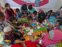 Students play in the Back to School Campaign held by the Sayangi Tunas Cilik Foundation (STC) at Vatulemo Field, Palu, Central Sulawesi, Ind...