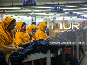 Workers at a garment factory work at MB Knit garment factory in Narayanganj, near Dhaka. (