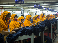 Workers at a garment factory work at MB Knit garment factory in Narayanganj, near Dhaka. (