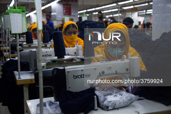 Workers at a garment factory work at MB Knit garment factory in Narayanganj, near Dhaka. 