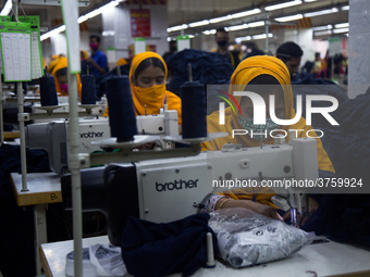 Workers at a garment factory work at MB Knit garment factory in Narayanganj, near Dhaka. (