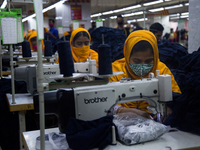 Workers at a garment factory work at MB Knit garment factory in Narayanganj, near Dhaka. (