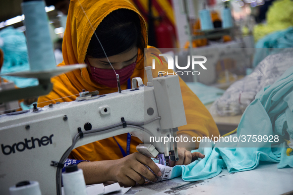 Workers at a garment factory work at MB Knit garment factory in Narayanganj, near Dhaka. 