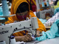 Workers at a garment factory work at MB Knit garment factory in Narayanganj, near Dhaka. (