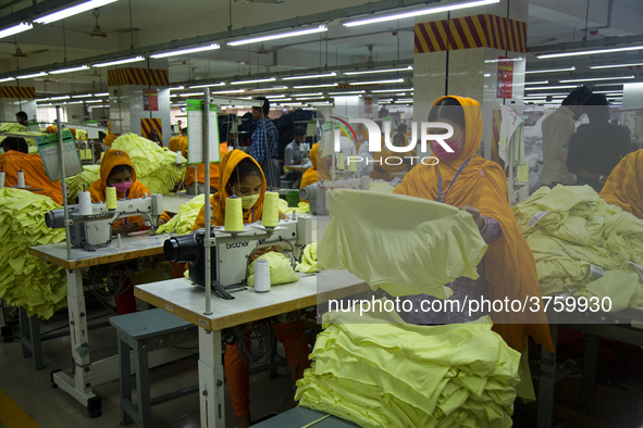 Workers at a garment factory work at MB Knit garment factory in Narayanganj, near Dhaka. 