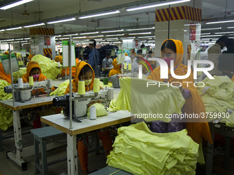 Workers at a garment factory work at MB Knit garment factory in Narayanganj, near Dhaka. (