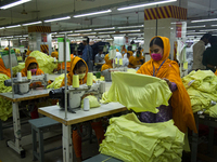 Workers at a garment factory work at MB Knit garment factory in Narayanganj, near Dhaka. (