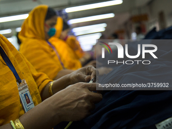 Workers at a garment factory work at MB Knit garment factory in Narayanganj, near Dhaka. (