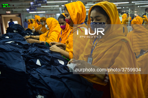 Workers at a garment factory work at MB Knit garment factory in Narayanganj, near Dhaka. 