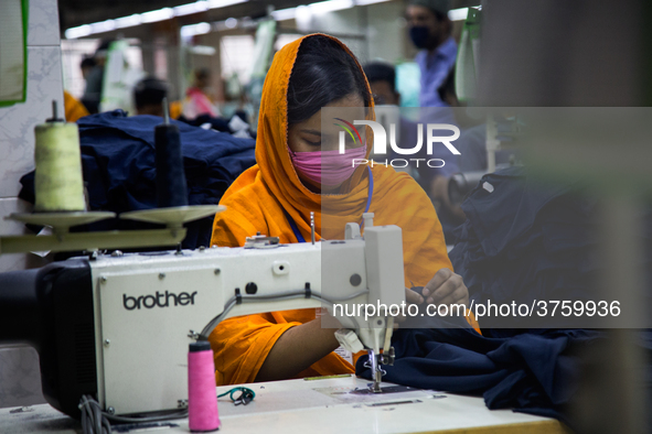 Workers at a garment factory work at MB Knit garment factory in Narayanganj, near Dhaka. 