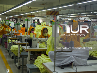 Workers at a garment factory work at MB Knit garment factory in Narayanganj, near Dhaka. (