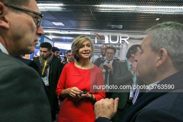 President of the Ile-de France regional council Valerie Pecresse (C, in red) speaks with the President of the Hauts-de-France region, Xavier...