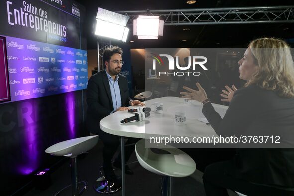 French Junior Minister for the Digital Sector attached to Finance Minister in charge of Public Action and Accounts Mounir Mahjoubi (C) visit...