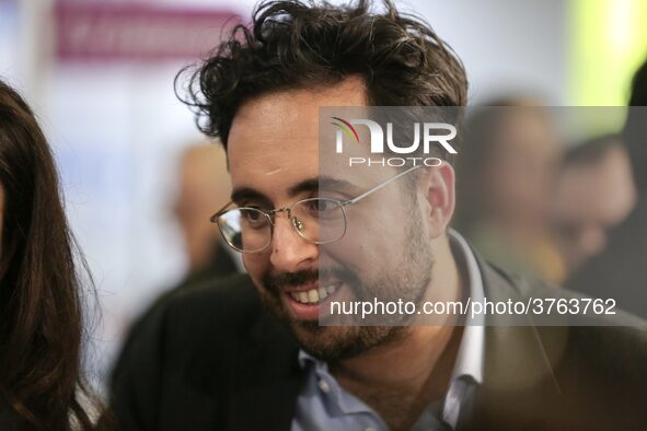 French Junior Minister for the Digital Sector attached to Finance Minister in charge of Public Action and Accounts Mounir Mahjoubi (C) visit...