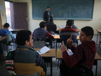 Deaf Palestinian students in Gaza get lessons in their classroom at first school in Palestine care with them, on 10 February 2019. (