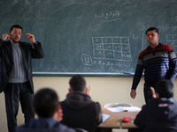 Deaf Palestinian students in Gaza get lessons in their classroom at first school in Palestine care with them, on 10 February 2019. (