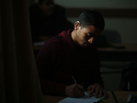 Deaf Palestinian students in Gaza get lessons in their classroom at first school in Palestine care with them, on 10 February 2019. (