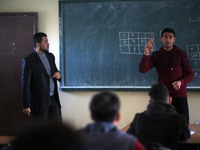 Deaf Palestinian students in Gaza get lessons in their classroom at first school in Palestine care with them, on 10 February 2019. (