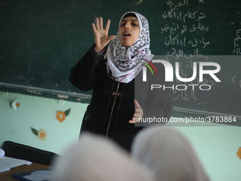 Deaf Palestinian students in Gaza get lessons in their classroom at first school in Palestine care with them, on 10 February 2019. (