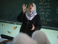 Deaf Palestinian students in Gaza get lessons in their classroom at first school in Palestine care with them, on 10 February 2019. (