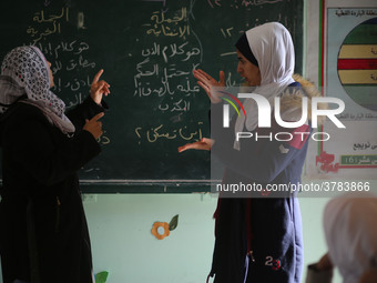 Deaf Palestinian students in Gaza get lessons in their classroom at first school in Palestine care with them, on 10 February 2019. (