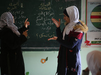 Deaf Palestinian students in Gaza get lessons in their classroom at first school in Palestine care with them, on 10 February 2019. (