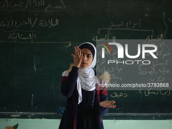 Deaf Palestinian students in Gaza get lessons in their classroom at first school in Palestine care with them, on 10 February 2019. (