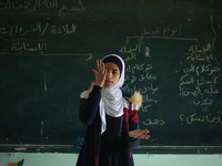 Deaf Palestinian students in Gaza get lessons in their classroom at first school in Palestine care with them, on 10 February 2019. (