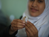 Deaf Palestinian students in Gaza get lessons in their classroom at first school in Palestine care with them, on 10 February 2019. (