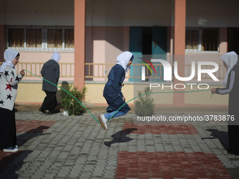 Deaf Palestinian students play in the school yard at first school in Palestine care with them, on 10 February 2019. (