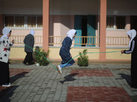 Deaf Palestinian students play in the school yard at first school in Palestine care with them, on 10 February 2019. (