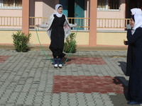 Deaf Palestinian students play in the school yard at first school in Palestine care with them, on 10 February 2019. (