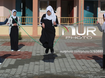 Deaf Palestinian students play in the school yard at first school in Palestine care with them, on 10 February 2019. (