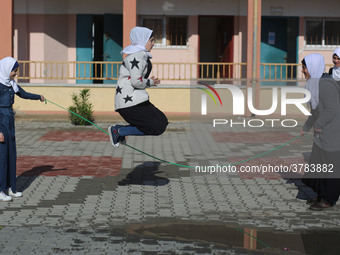 Deaf Palestinian students play in the school yard at first school in Palestine care with them, on 10 February 2019. (