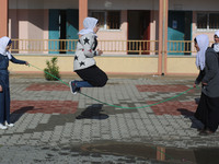 Deaf Palestinian students play in the school yard at first school in Palestine care with them, on 10 February 2019. (