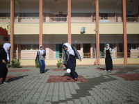 Deaf Palestinian students play in the school yard at first school in Palestine care with them, on 10 February 2019. (