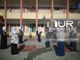 Deaf Palestinian students play in the school yard at first school in Palestine care with them, on 10 February 2019. (