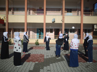 Deaf Palestinian students play in the school yard at first school in Palestine care with them, on 10 February 2019. (